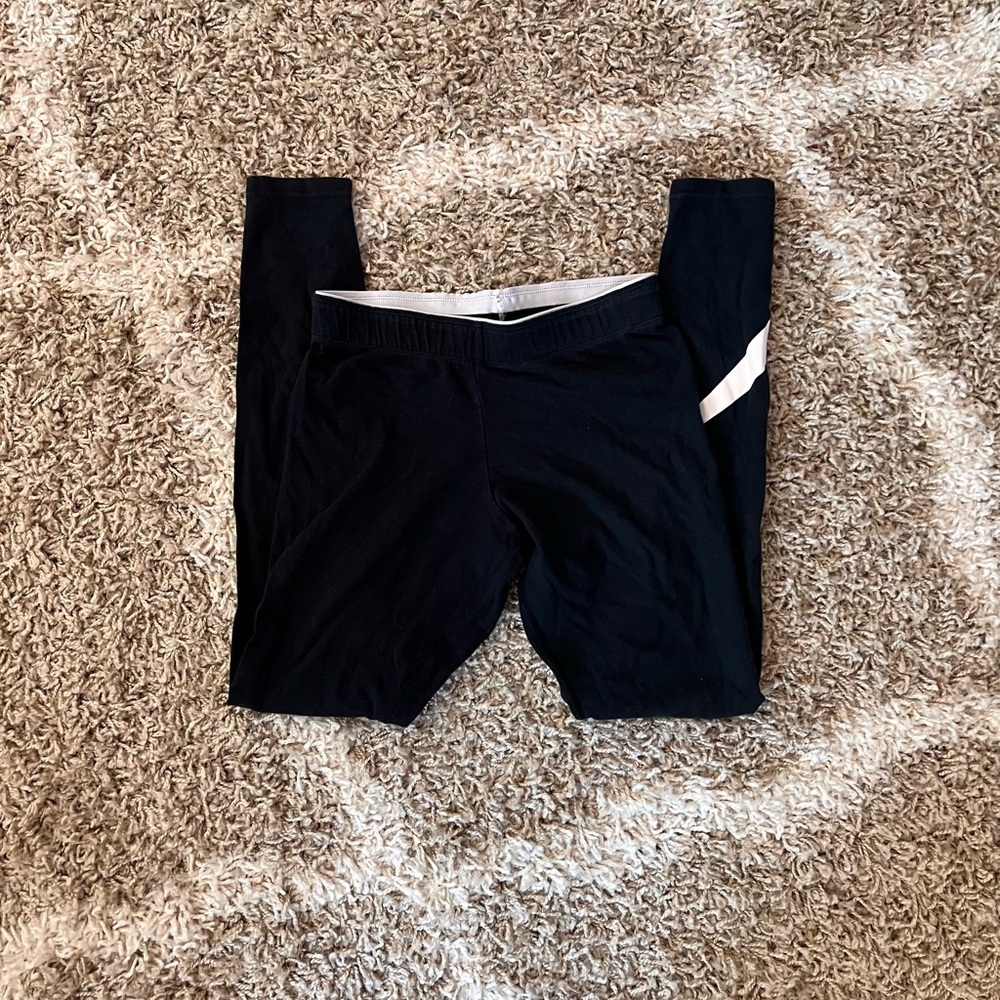 Nike Black Leggings with White Side Accent.